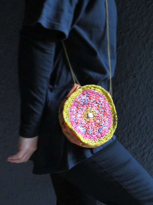 round multi color handbag